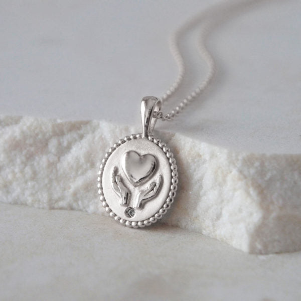 murkani freedom healing hands necklace silver